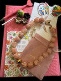 Collier perles en résine rose